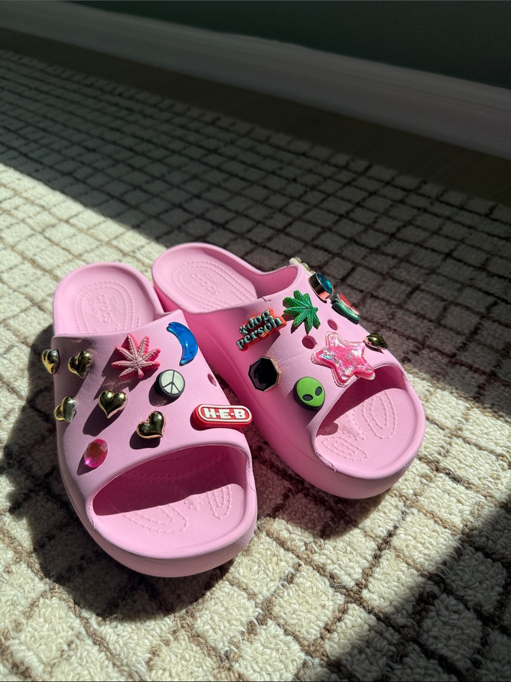 Women's Pink Croc Slide Sandals with Decorative Jibbitz included.